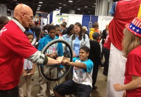 Visitors learn about gyroscopic forces in a rotating chair